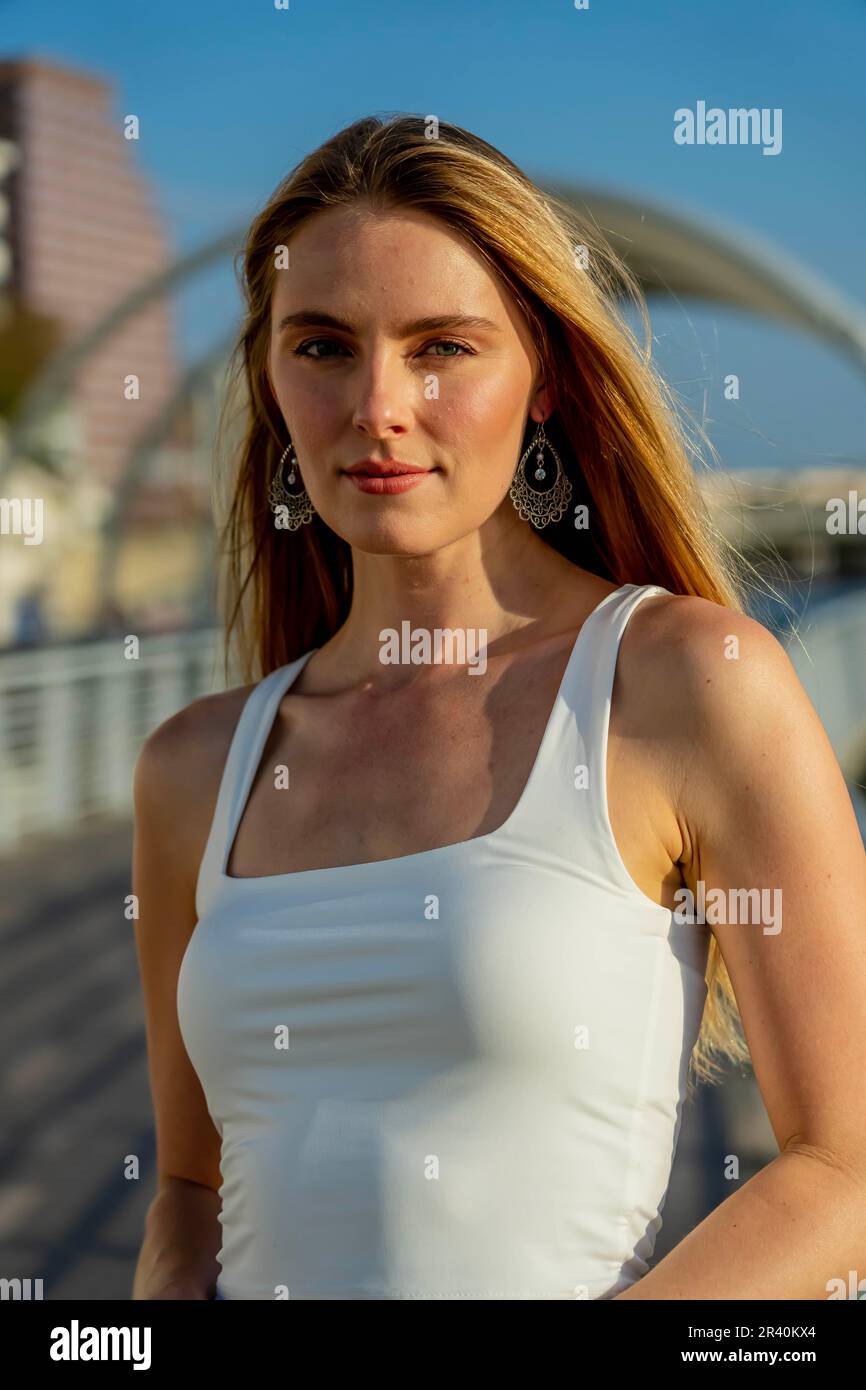 A Lovely Blonde Model Enjoys The Summer Weather In An Urban Environment Stock Photo