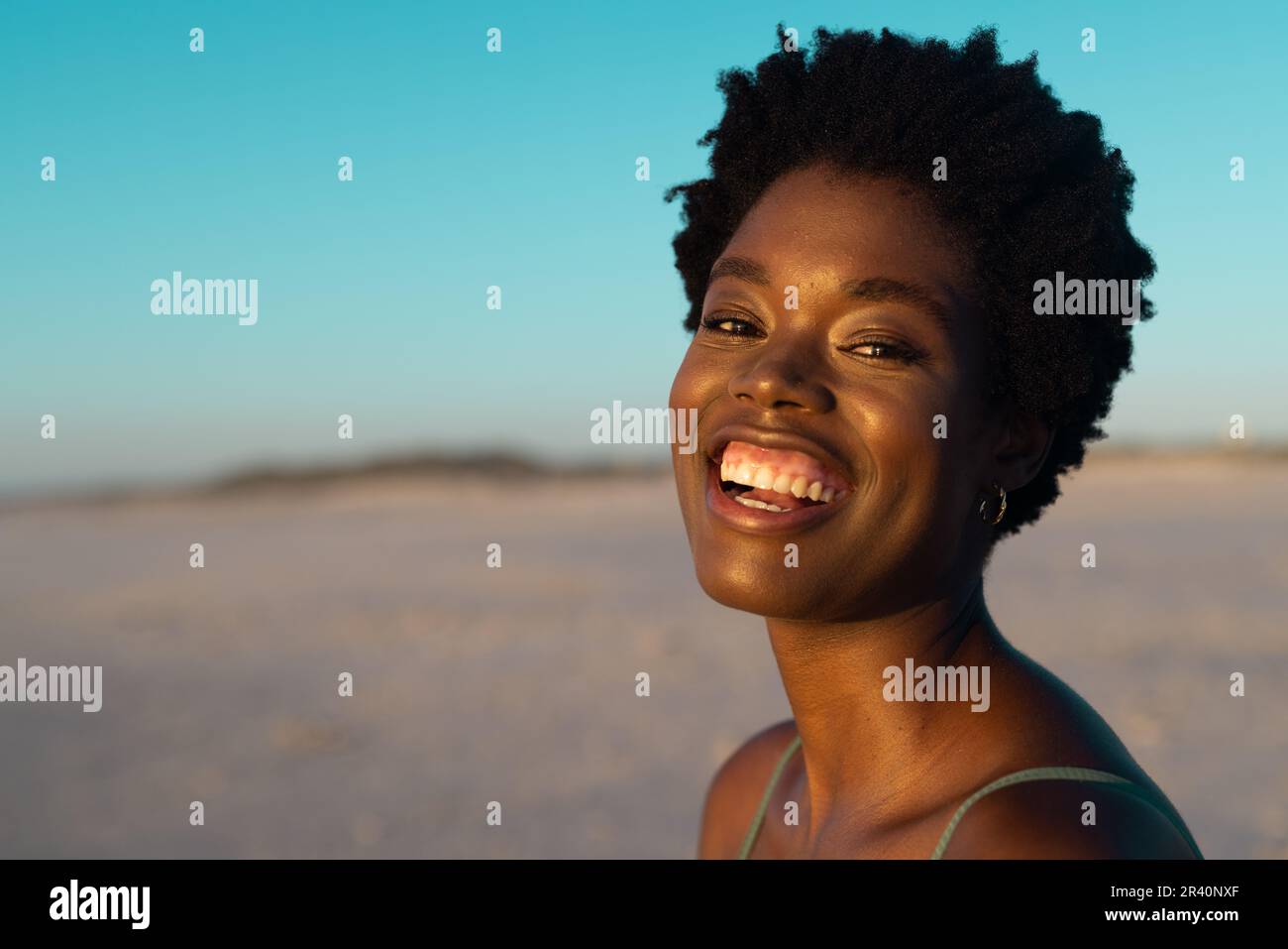 African american woman on the beach laughing hi-res stock photography ...