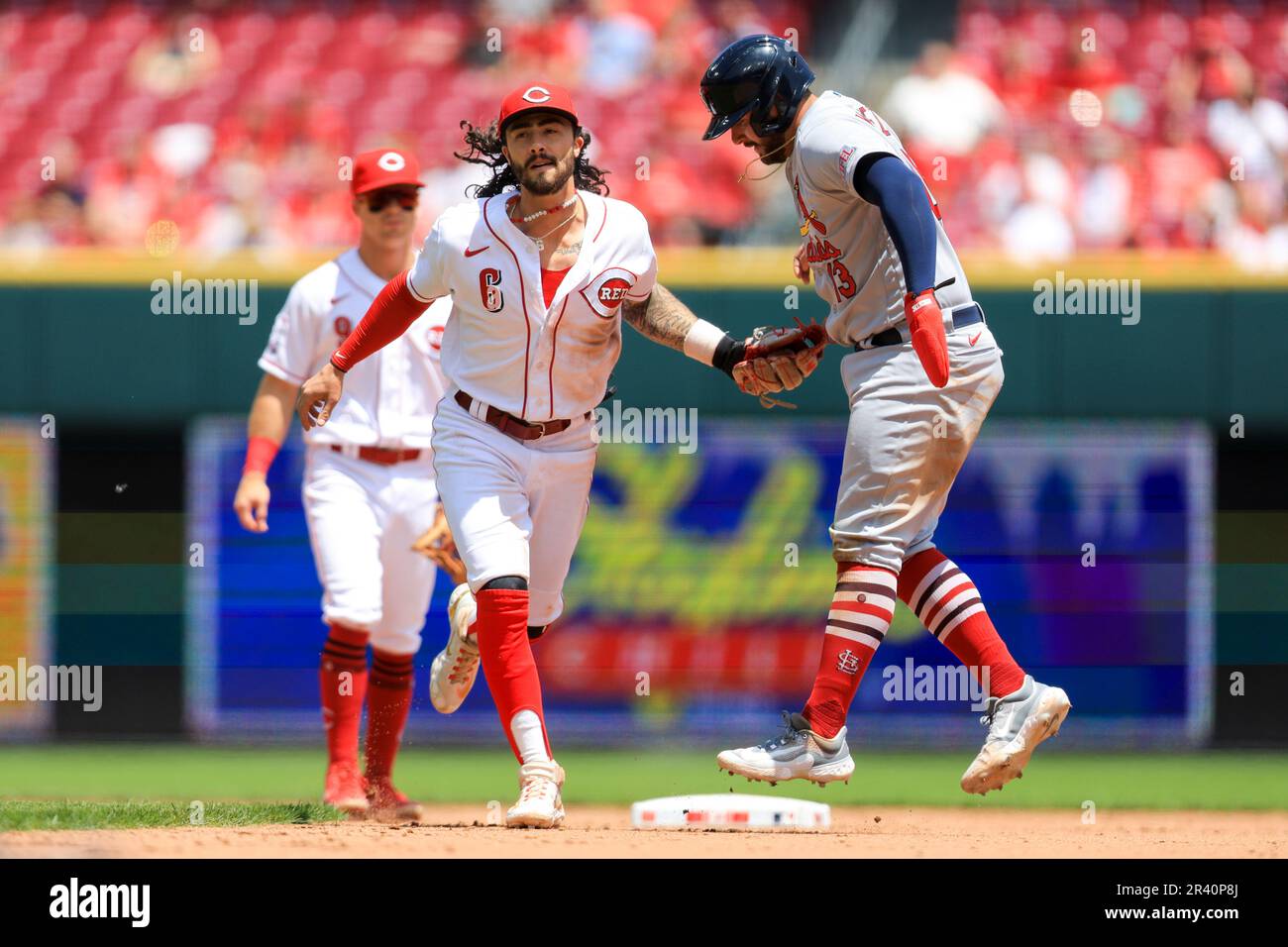 Cincinnati Reds' Jonathan India, left, receives the Major League Baseball  Rookie of the Year Award presented by Cincinnati Bengals' Ja'marr Chase  prior to a baseball between the Cleveland Guardians and the Cincinnati