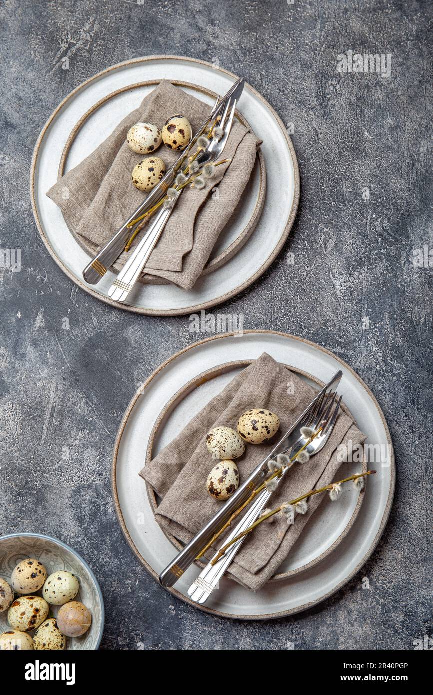 Easter festive table setting with quail eggs. top view Stock Photo