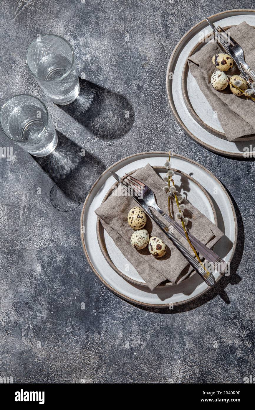 Easter festive table setting with quail eggs. top view Stock Photo