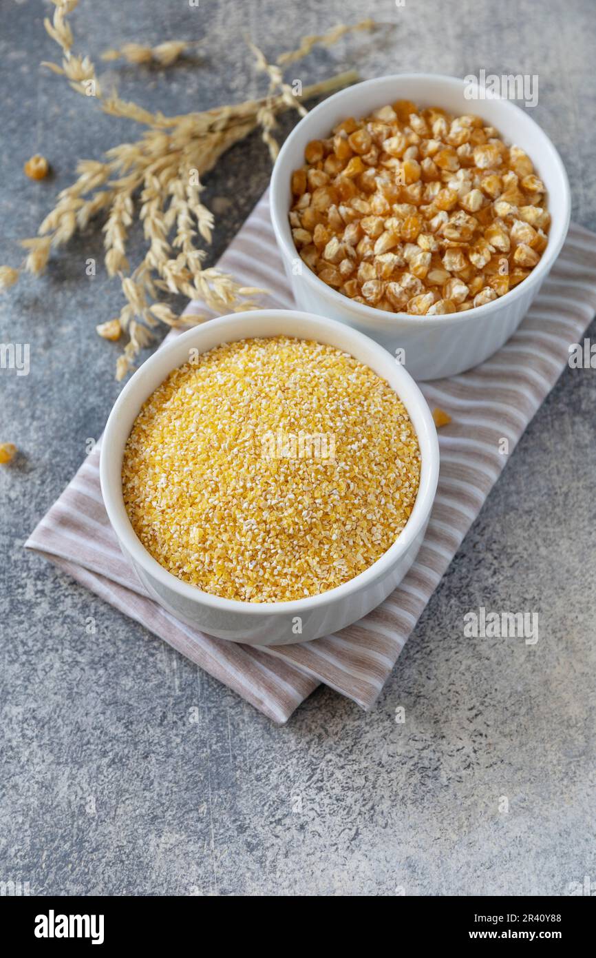 Food and baking gluten-free protein ingredient Ð¡orn flour wholesome and raw corn over gray stone table. Copy space. Stock Photo