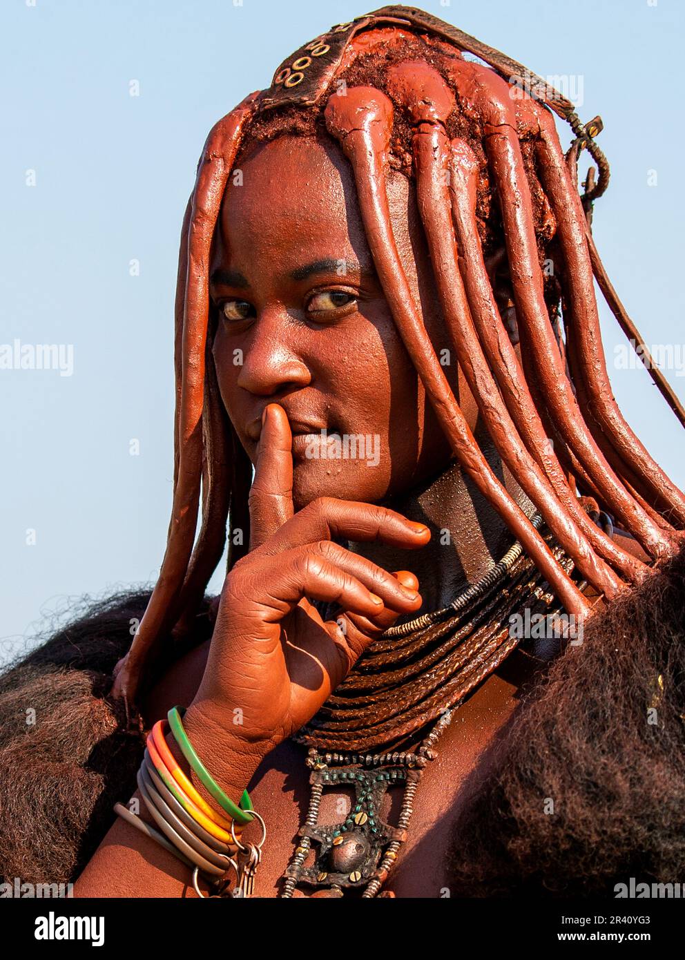 Portrait of a young woman of the Himba tribe with a traditional ...