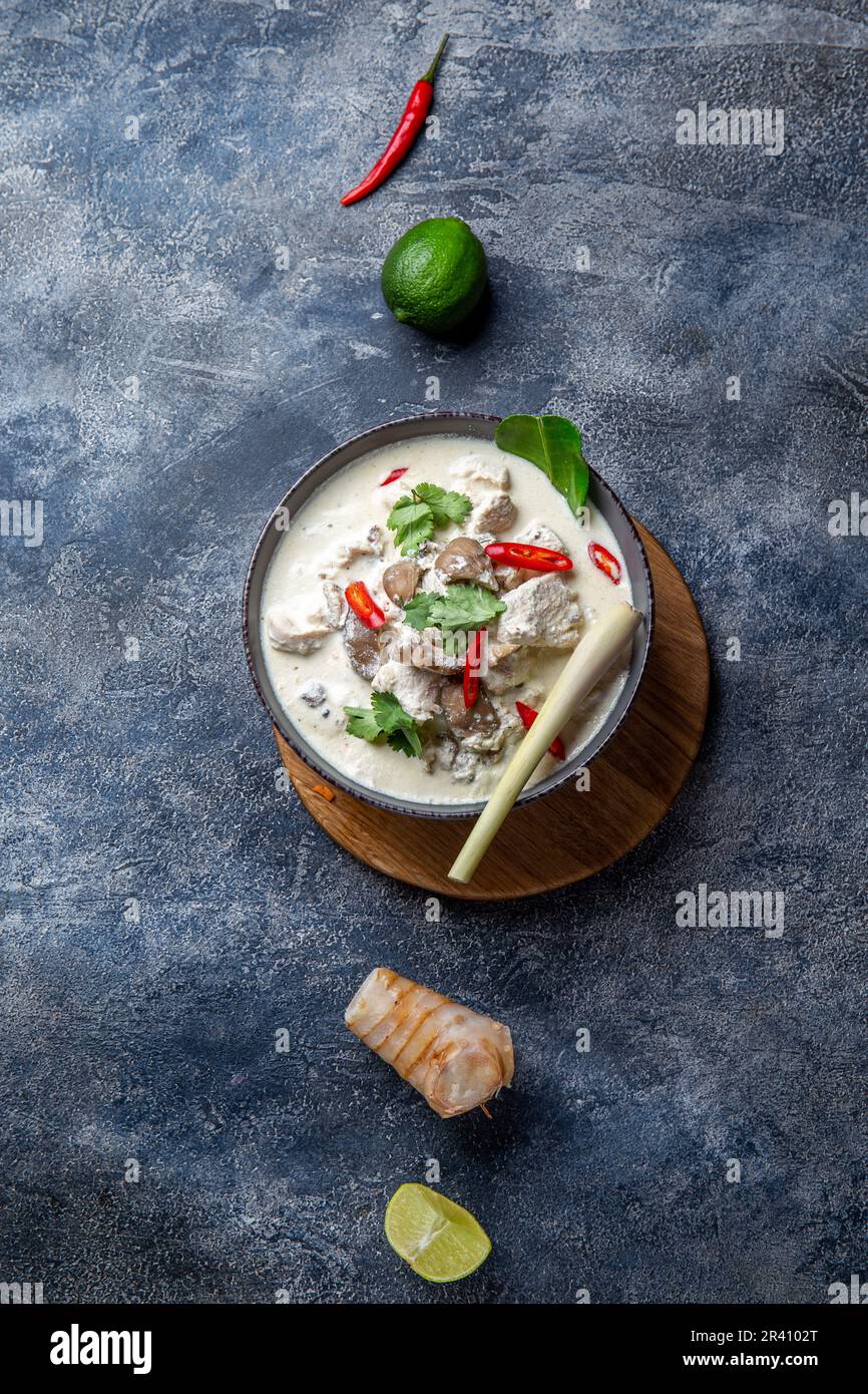 Thai chicken mushroom coconut milk soup TOM KHA GAI in bowl with thai