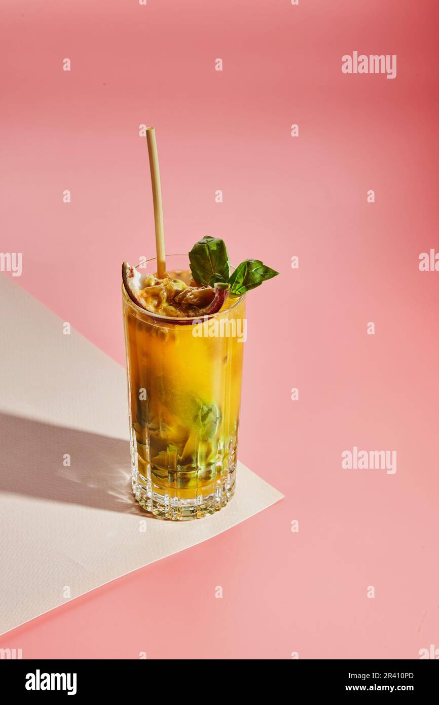 Cold alcoholic or non-alcoholic cocktail on pastel background. Hard light, deep shadow. Stock Photo