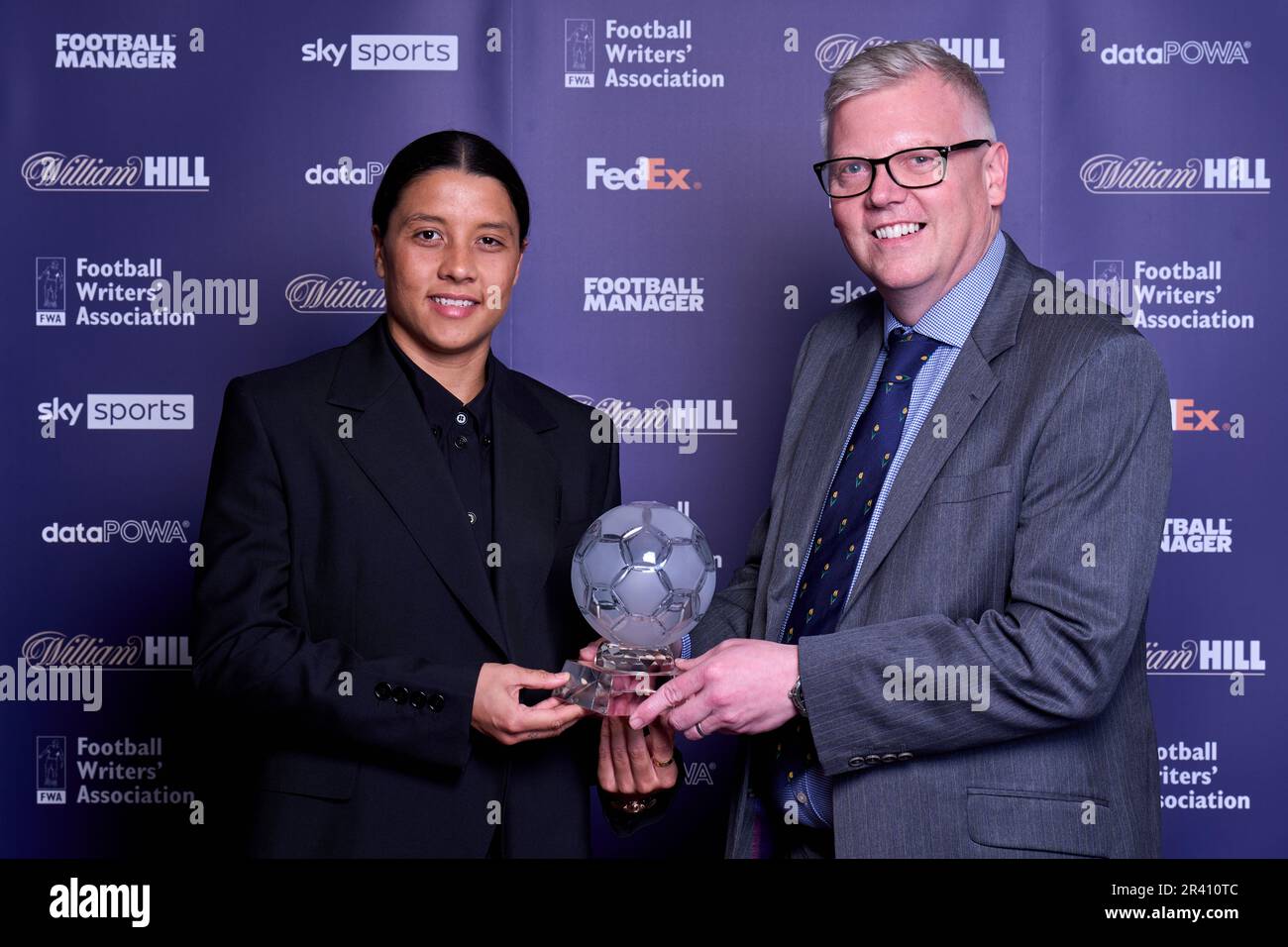 Sam Kerr (left) with her FWA women’s player of the year trophy alongside chair of the FWA John Cross during the FWA Footballer of the Year awards held at the Landmark Hotel, London. Picture date: Thursday May 25, 2023. Stock Photo