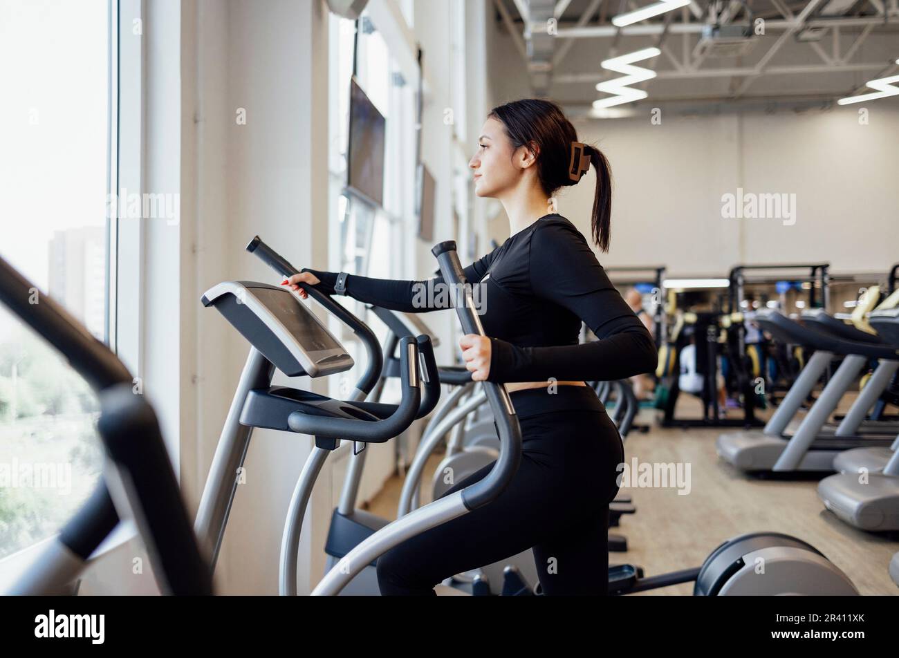 Doing cardio on the treadmill. Running on a treadmill. Stock Photo