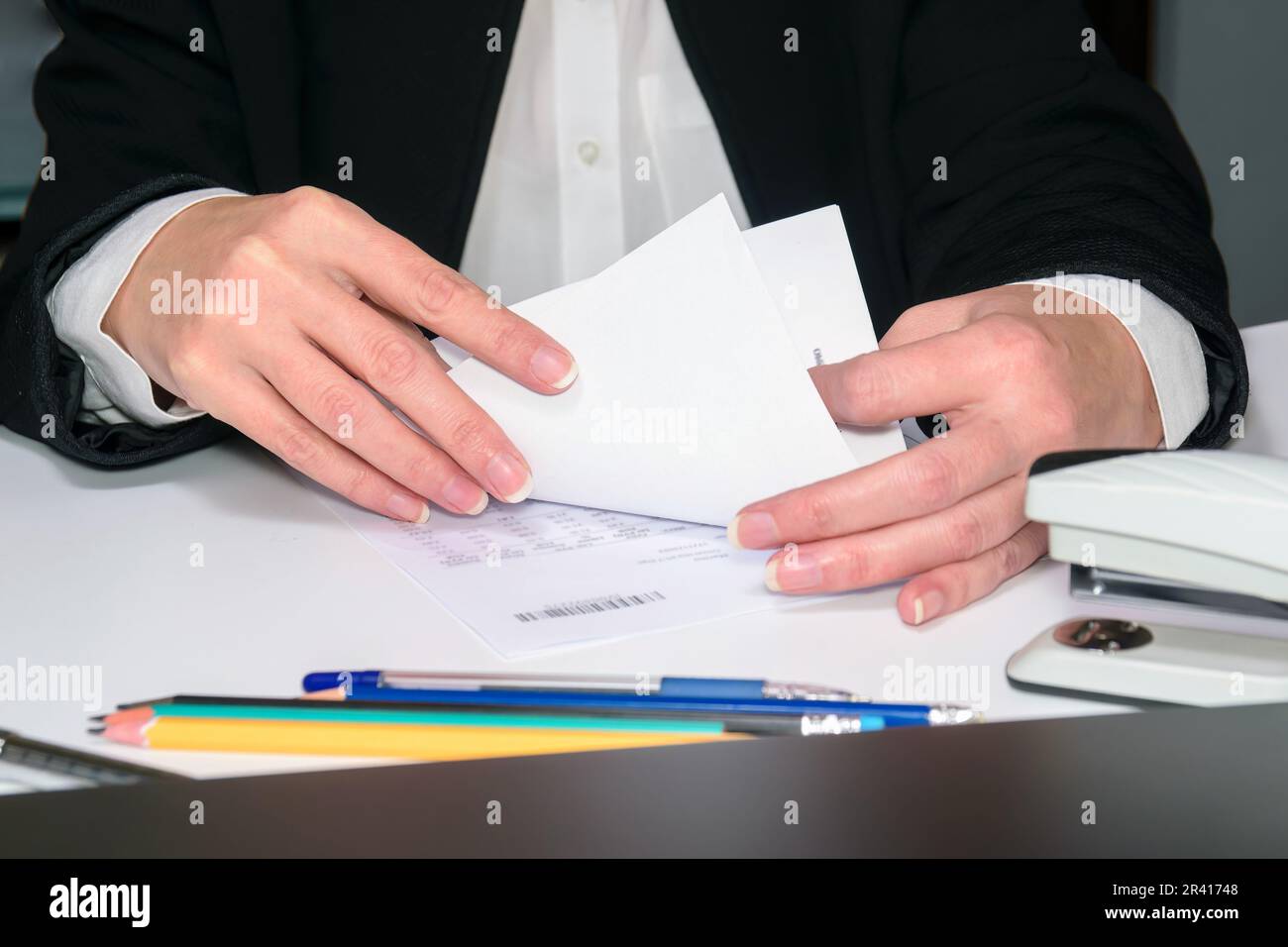 accountant works on a table with papers. financial report calculations in the office Stock Photo