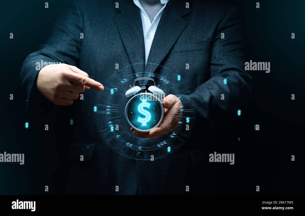 Businessman holding an alarm clock, the concept of time is money, the speed of decision making Stock Photo