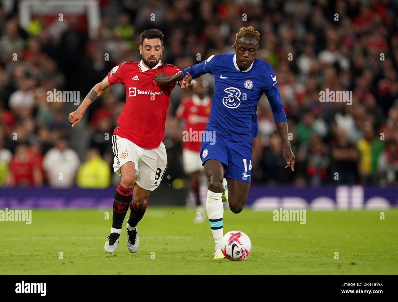 Manchester United's Bruno Fernandes (left) and Chelsea's Trevoh Chalobah in action during the Premier League match at Old Trafford, Manchester. Picture date: Thursday May 25, 2023. Stock Photo