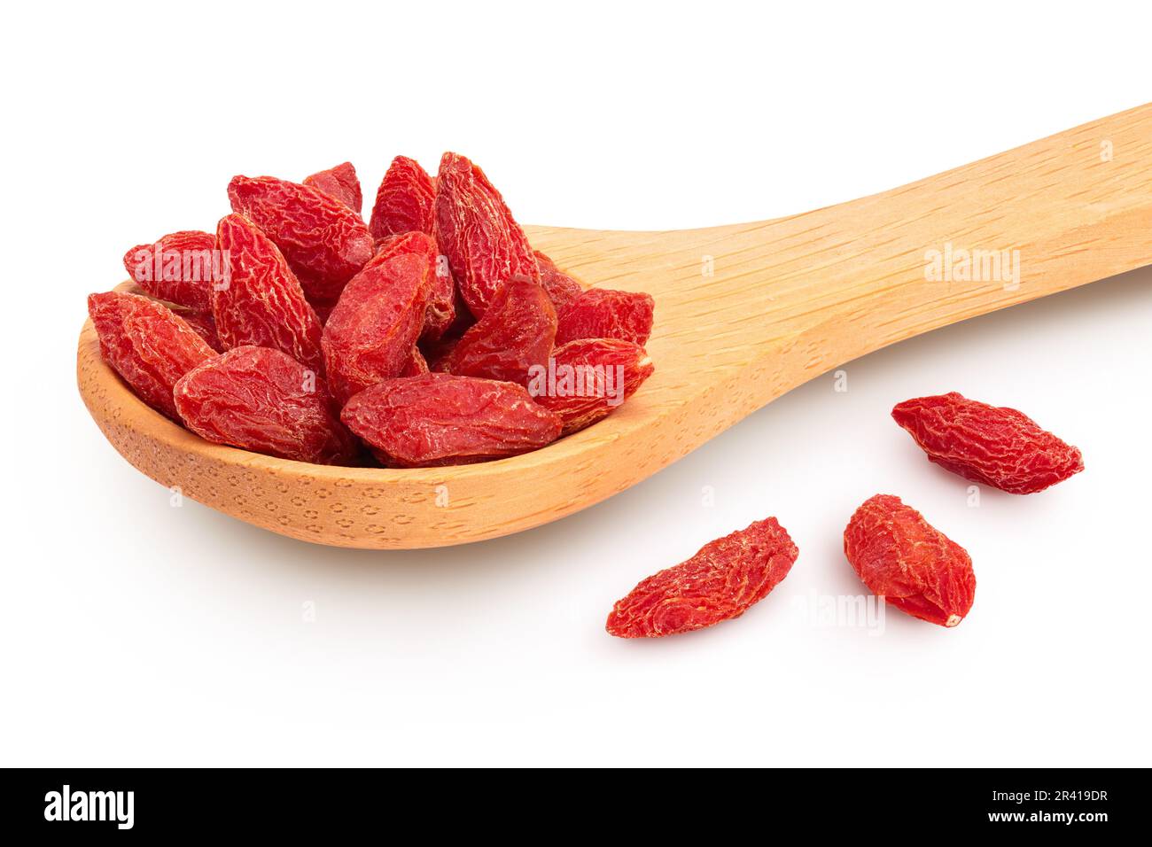 Dried goji berries in wooden spoon isolated on white background. Stock Photo
