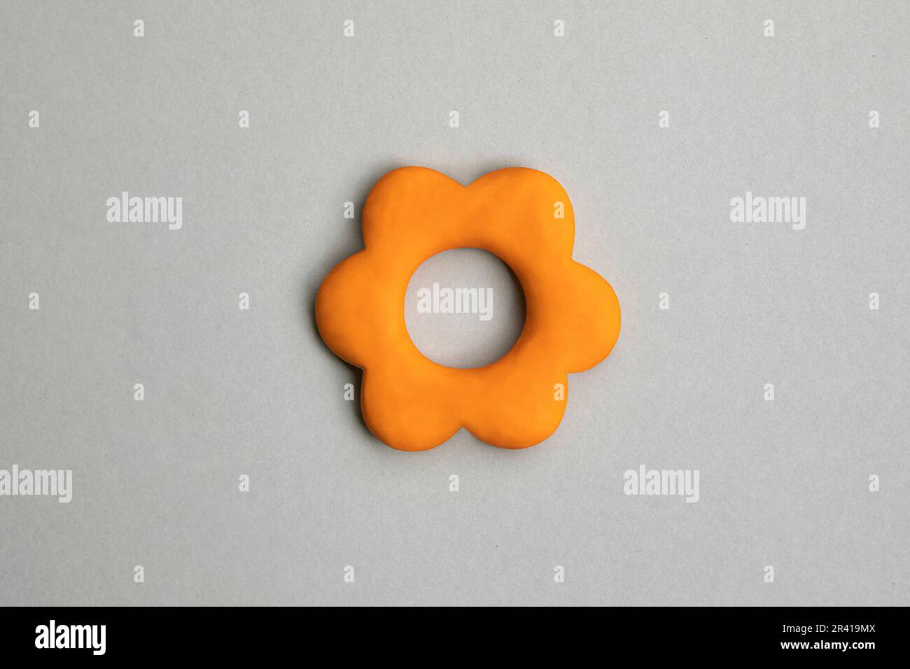 Simple three dimensional icon of flower head in bloom. Symbol of prosperity, growth concept, growing buissnes. Orange flower sign on neutral backgroun Stock Photo