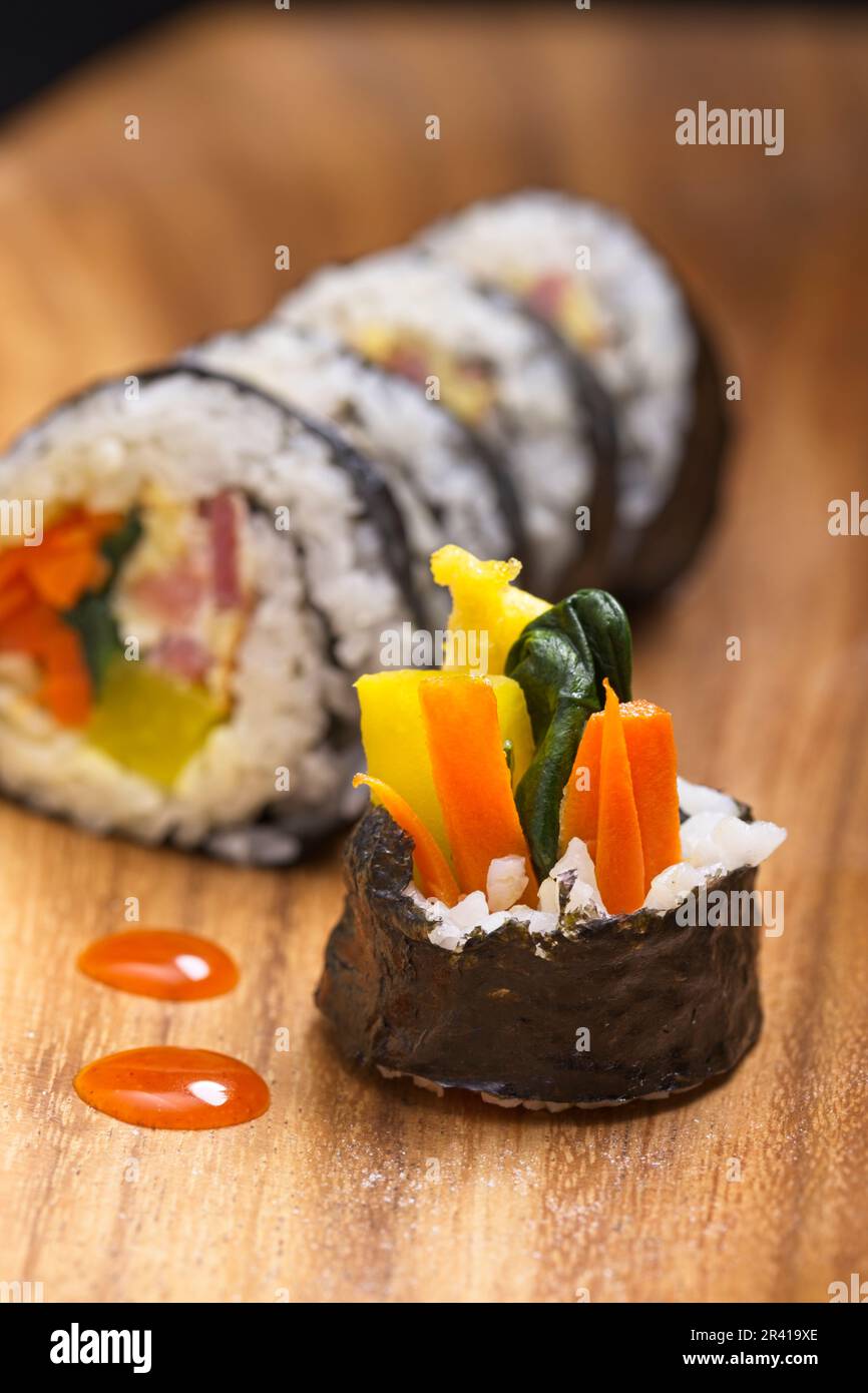 A close up of the end piece of a Korean treat called Kimbap. Food made