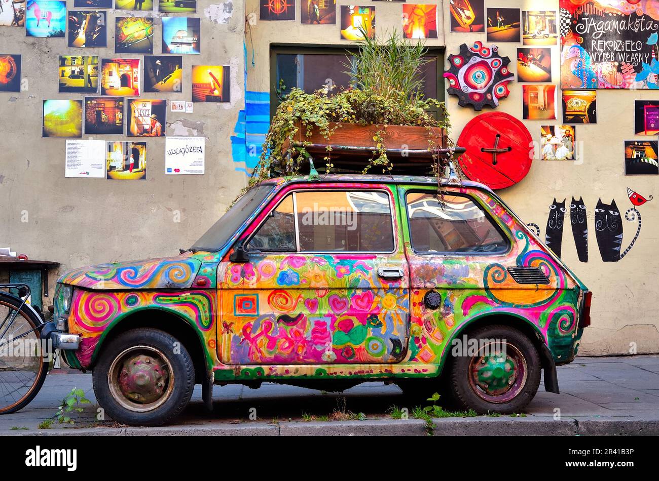 Krakow, Poland - October 21, 2012: Old Polish car Fiat 126 placed as a exhibit of local manufacture. Colorful car is part of the gallery, located on t Stock Photo