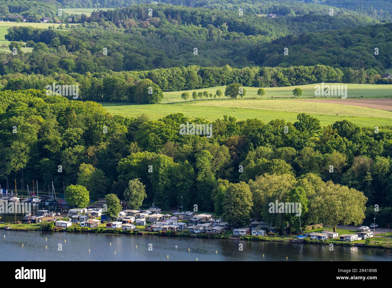 Lake Baldeney in Essen, Ruhr reservoir, view of the eastern shore, landscape in the Fischlaken district, Baldeneysee camping park, NRW, Germany, Stock Photo