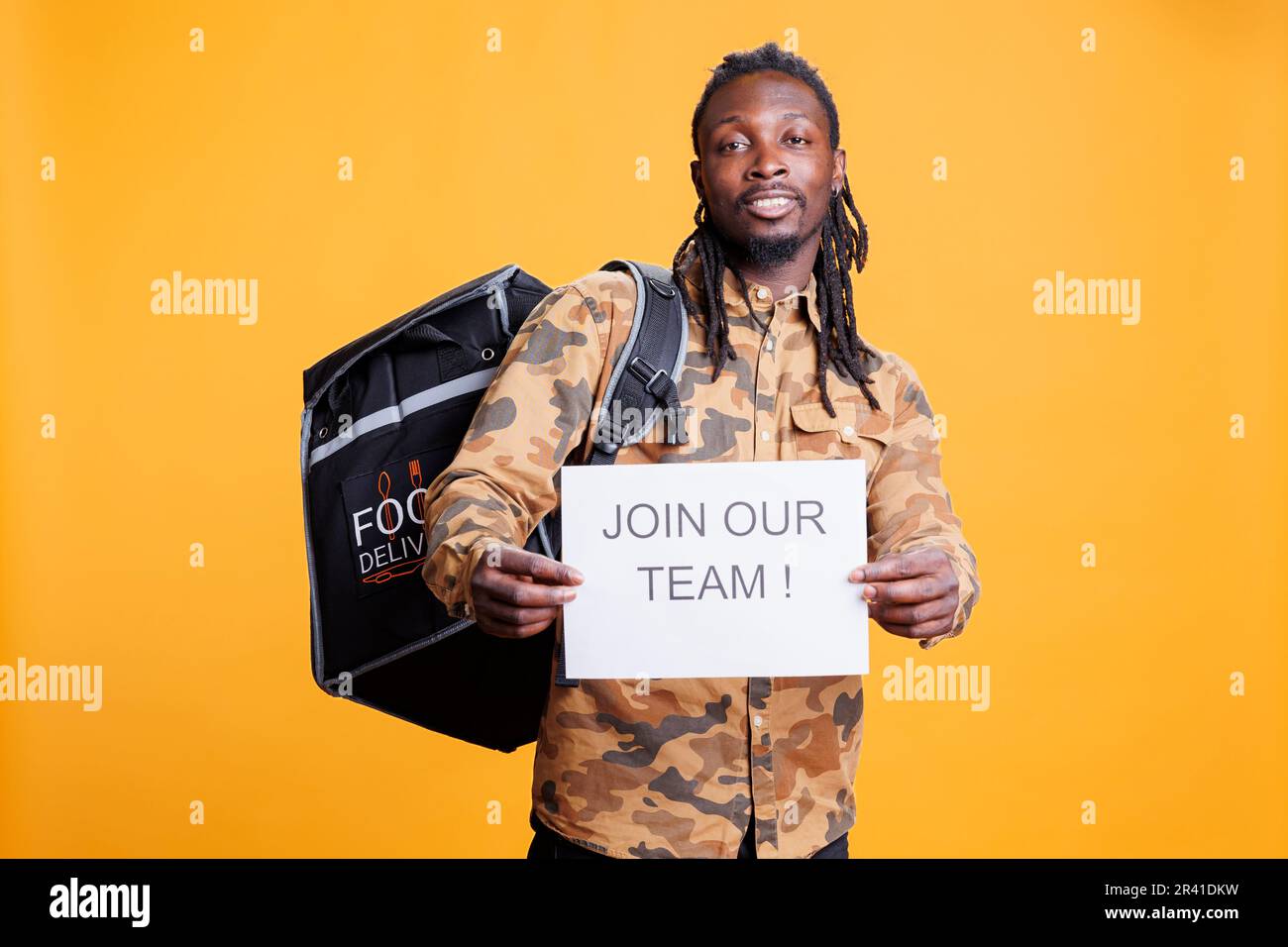 Takeaway employee holding job offer sign Stock Photo Alamy