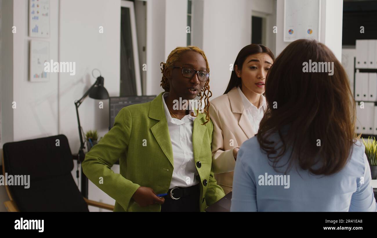 Diverse group of employees brainstorming growth ideas Stock Photo - Alamy