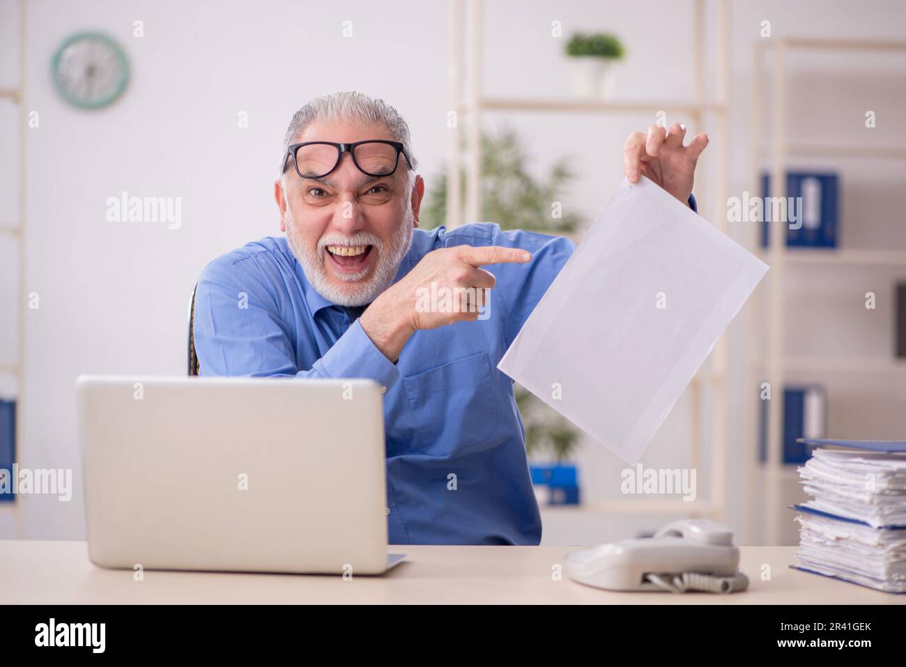 Old employee workaholic working hi-res stock photography and images - Alamy