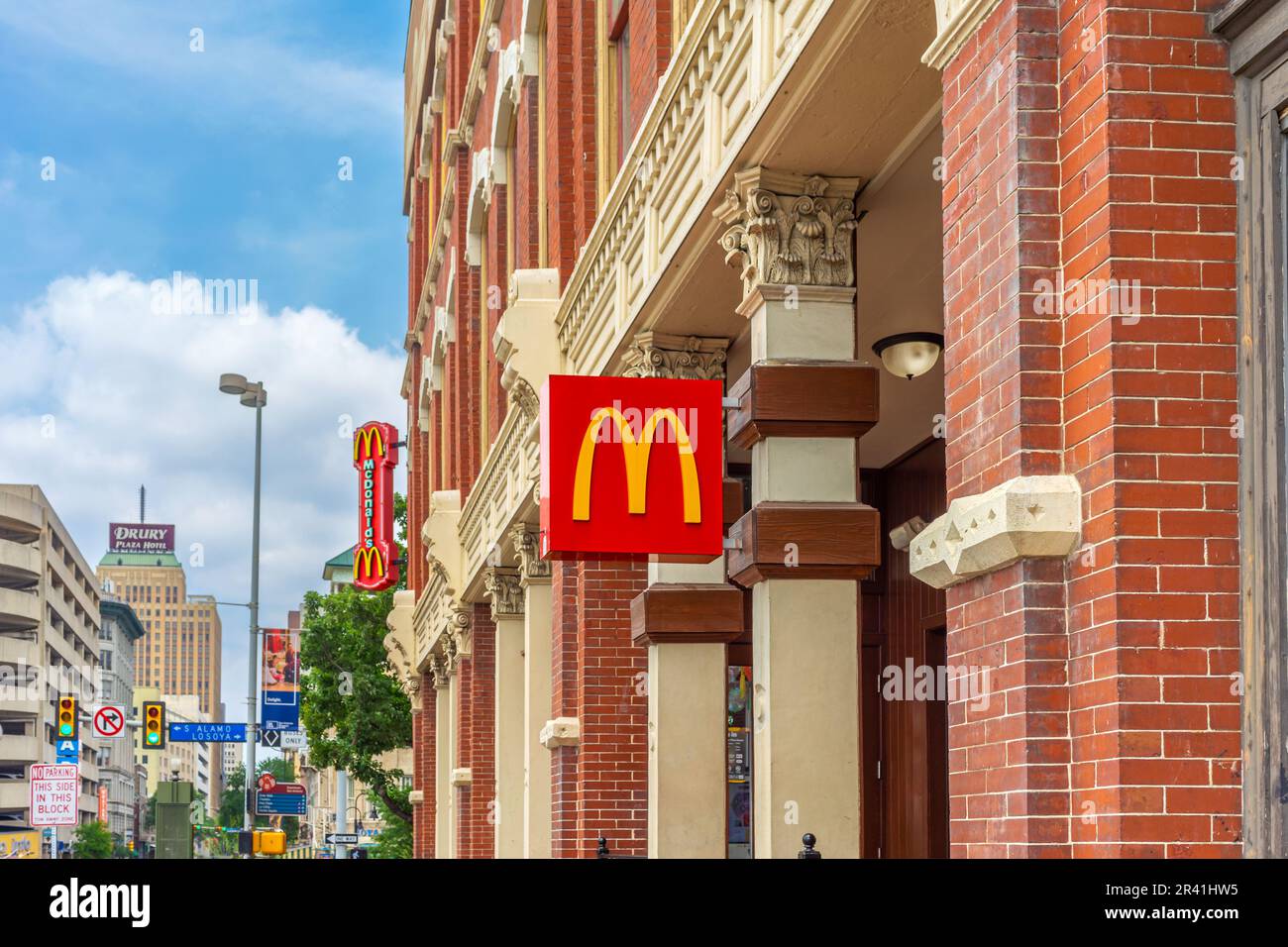 San Antonio, Texas, USA – May 8, 2023: A McDonald's restaurant signs on a historical brick building in downtown San Antonio, Texas. Stock Photo