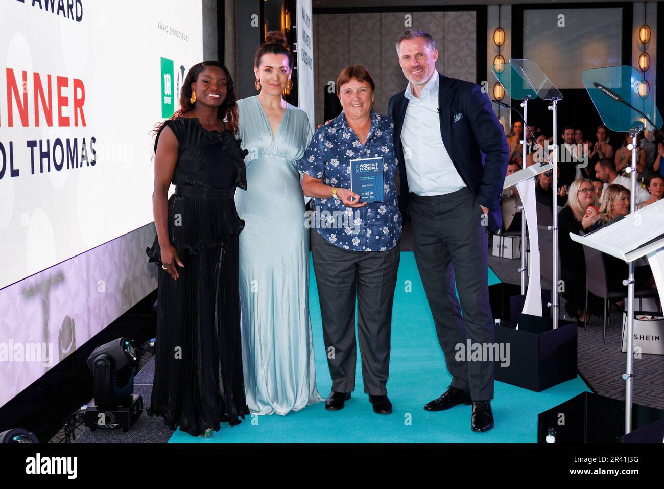 Caroline Thomas (second right) poses with the awarded Daily Mail Sport Choice Award, alongside co-hosts Eni Aluko (left) and Jamie Carragher (right) at the SHEIN Women's Football Awards held at Nobu Hotel, London. Picture date: Thursday May 25, 2022. Stock Photo