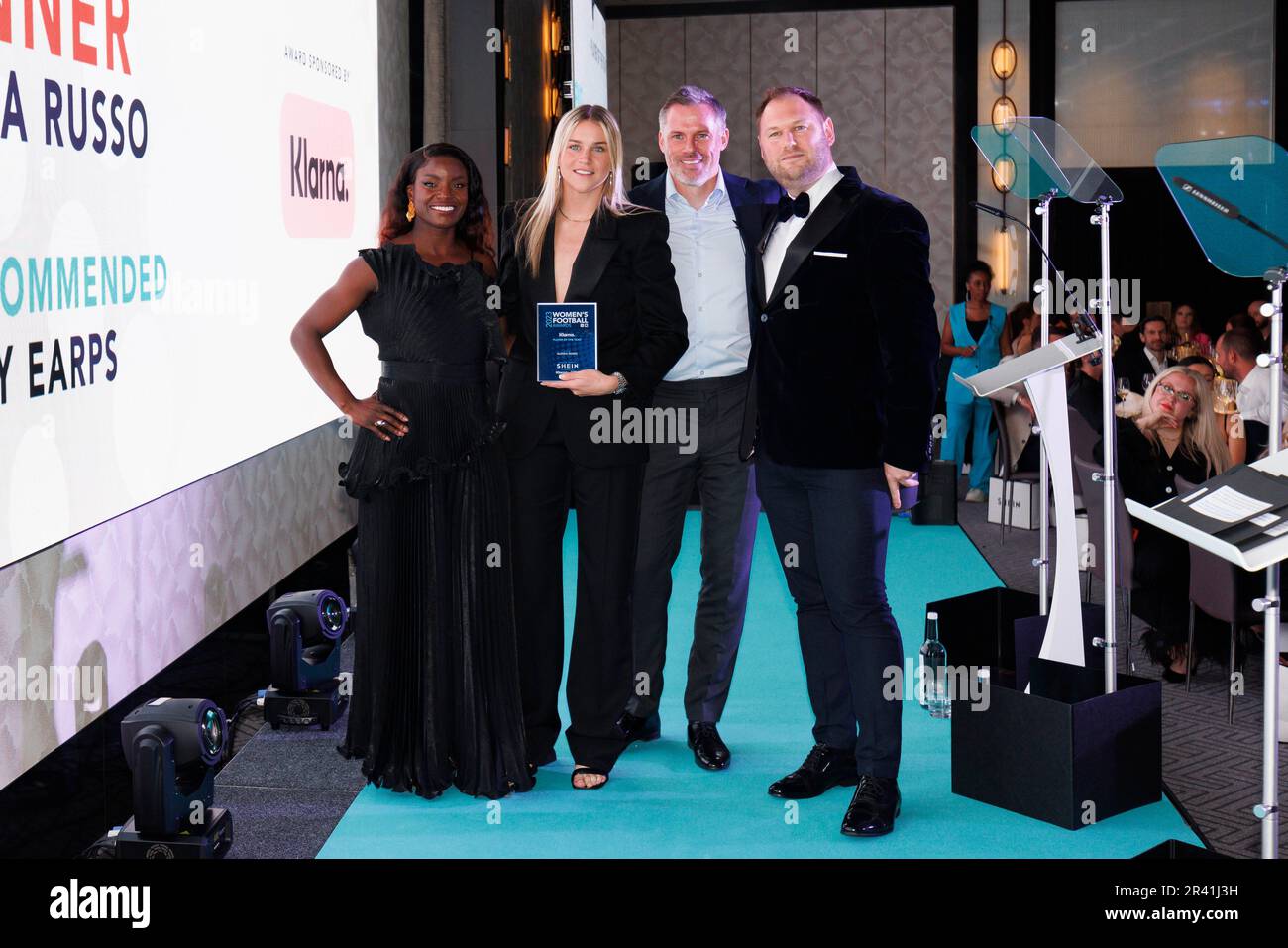 Alessia Russo (second left) poses with the Player of the Year award, alongside co-hosts Eni Aluko (left) and Jamie Carragher (second right) at the SHEIN Women's Football Awards held at Nobu Hotel, London. Picture date: Thursday May 25, 2022. Stock Photo