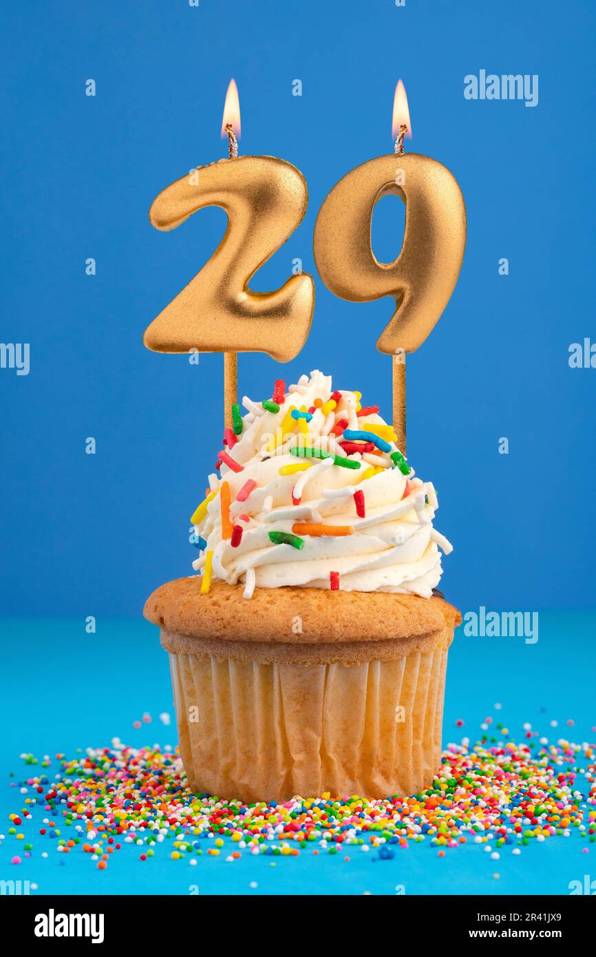 Candle number 29 - Cake birthday in blue background Stock Photo