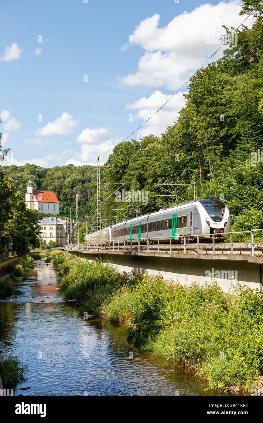 Alstom Coradia Continental regional train of Mitteldeutsche Regiobahn MRB portrait format in Tharandt, Germany Stock Photo