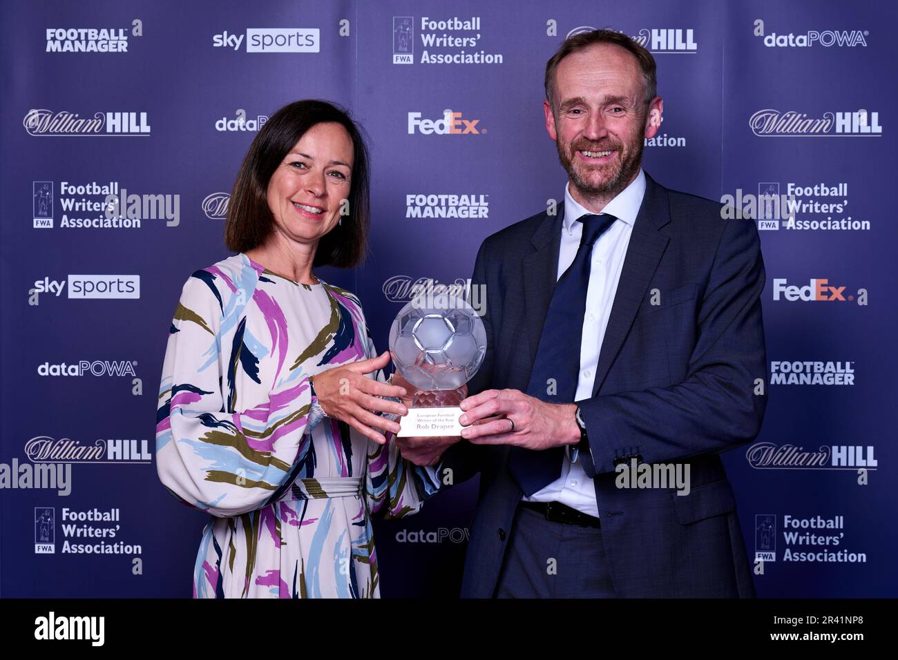 Kaat Vanderheyde (left) managing director of Brand and Sponsorship at FedEx Express Europe presents the Rob Draper of The Mail on Sunday with the European Football Writer of the year award during the FWA Footballer of the Year awards held at the Landmark Hotel, London. Picture date: Thursday May 25, 2023. Stock Photo