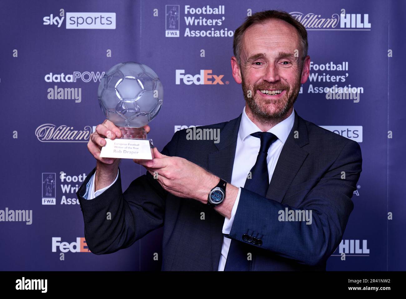 Kaat Vanderheyde (left) managing director of Brand and Sponsorship at FedEx Express Europe presents the Rob Draper of The Mail on Sunday with the European Football Writer of the year award during the FWA Footballer of the Year awards held at the Landmark Hotel, London. Picture date: Thursday May 25, 2023. Stock Photo