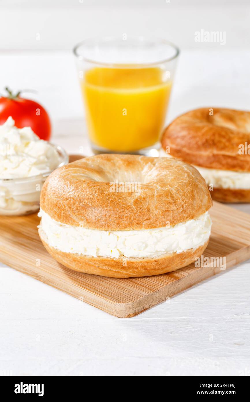 Bagel roll sandwich for breakfast topped with cream cheese portrait in