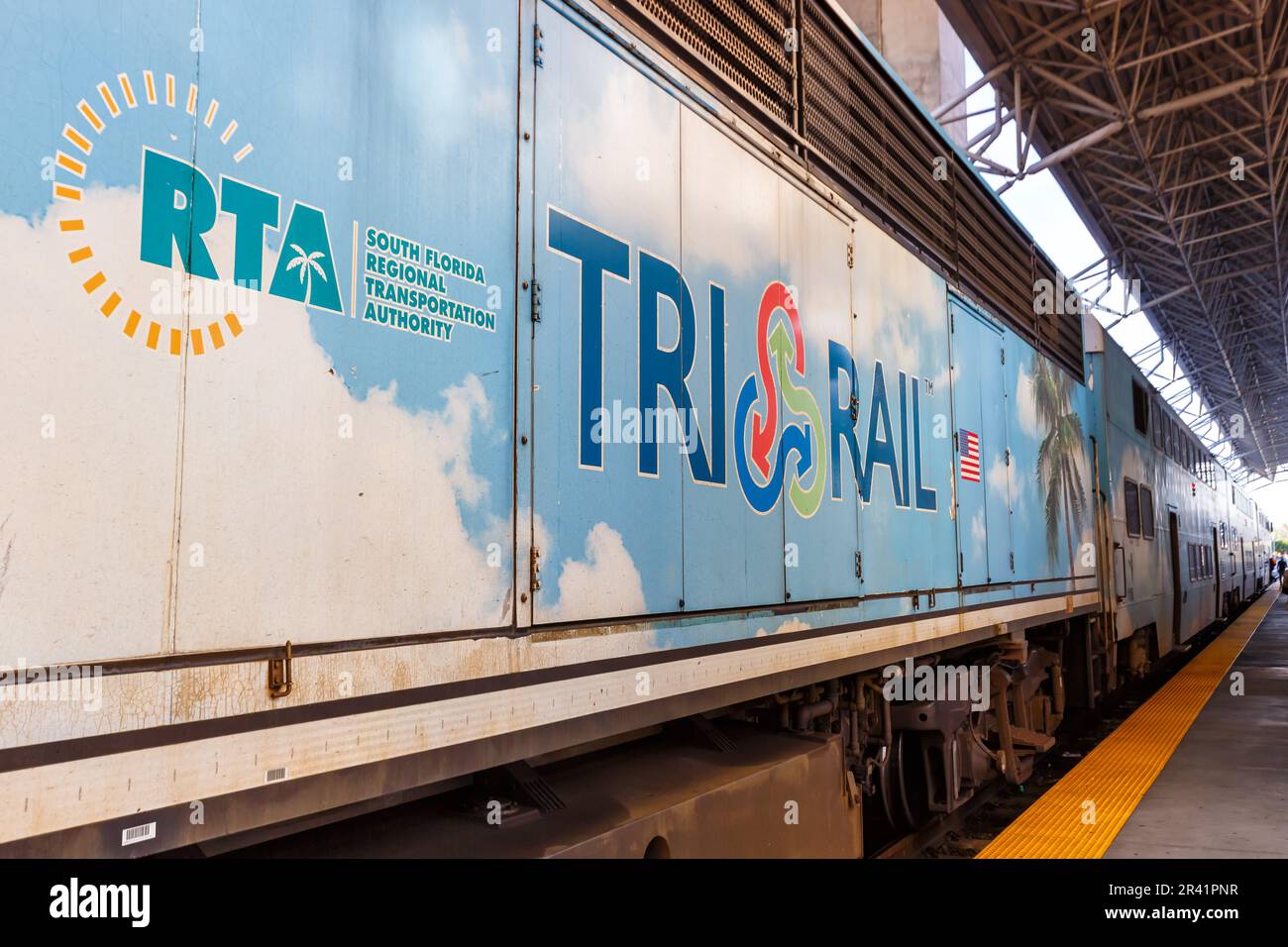 Tri-Rail logo on a regional train railroad at Miami Airport station in ...