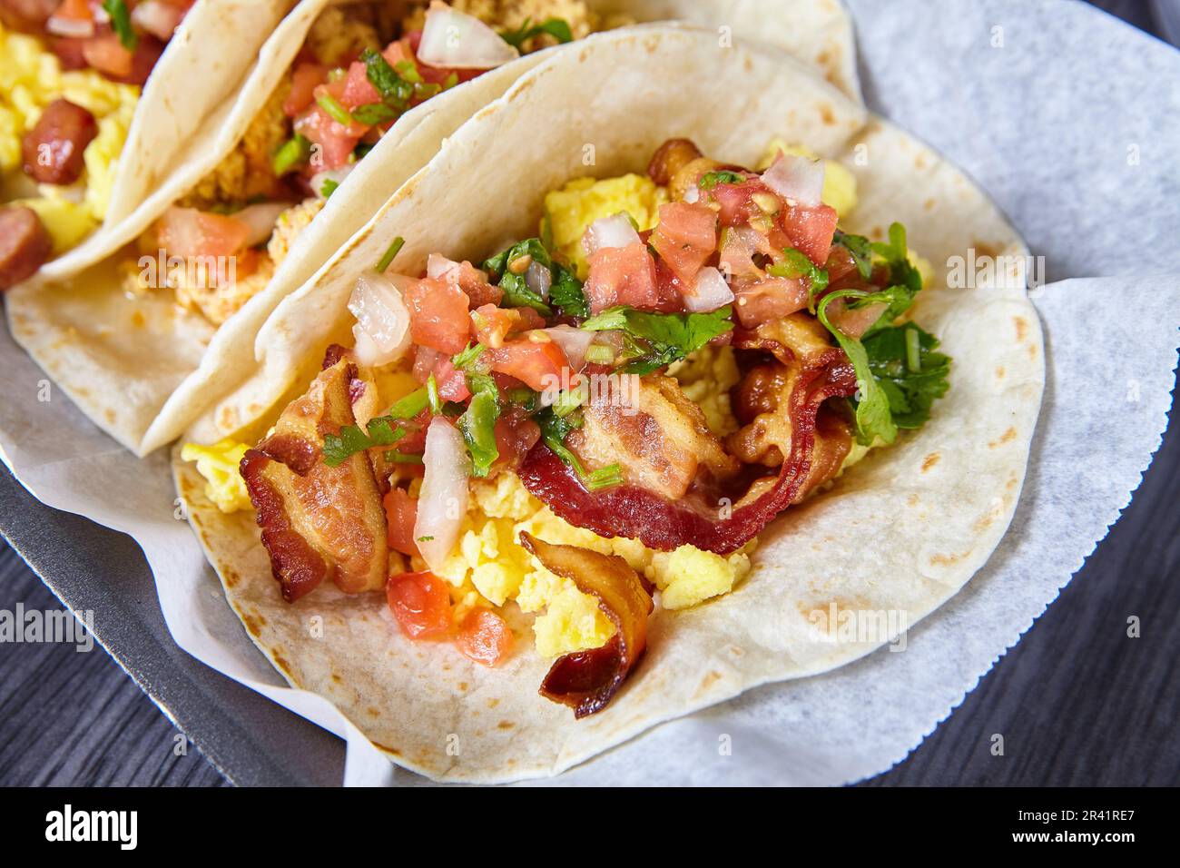 Mexican breakfast three tacos sausage egg bacon tomato chives flour