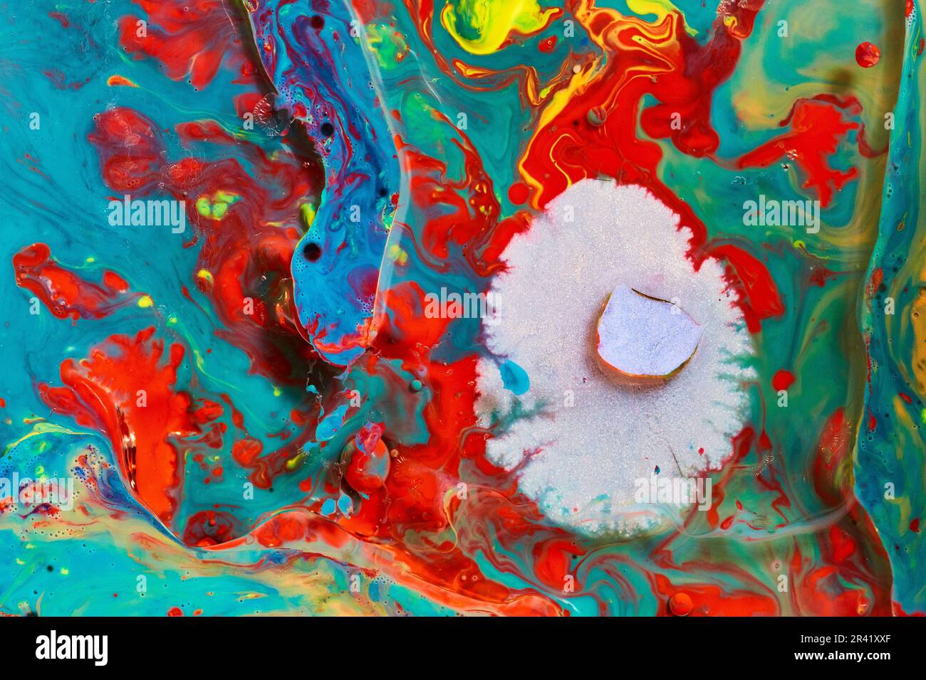 Abstract mold growing on vibrant oil paint surface of flashing colors