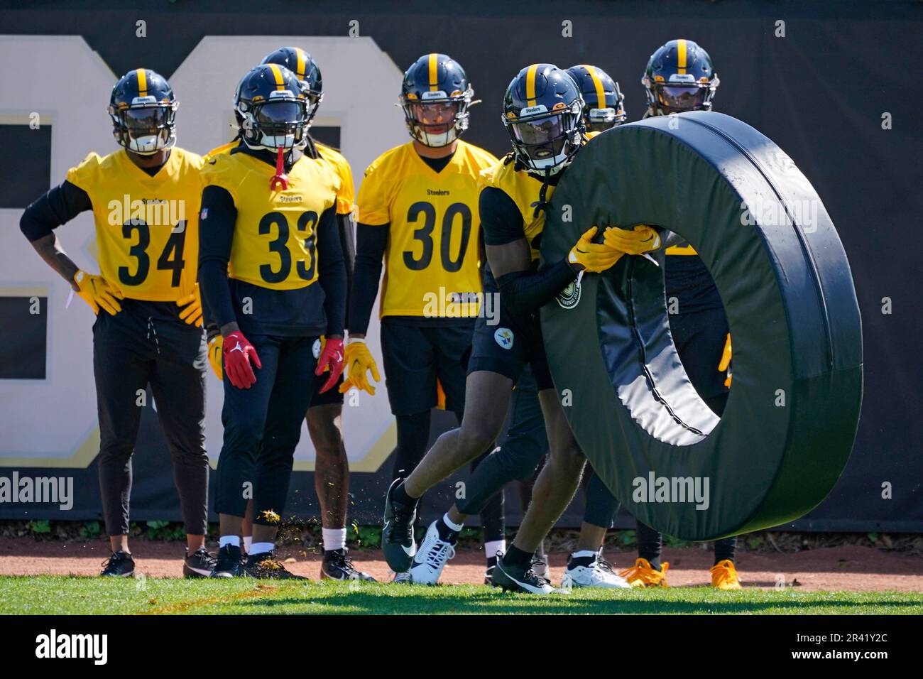 Pittsburgh Steelers cornerbacks watch as Joey Porter Jr. runs a drill