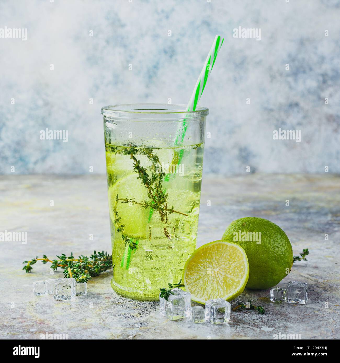 Lime Lemonade with thyme and ice Stock Photo - Alamy