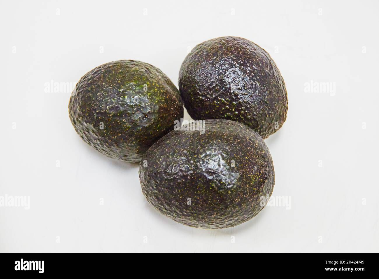 Avocado Stub Ripe Three ripe Mexican avocados on white background Stock Photo - Alamy