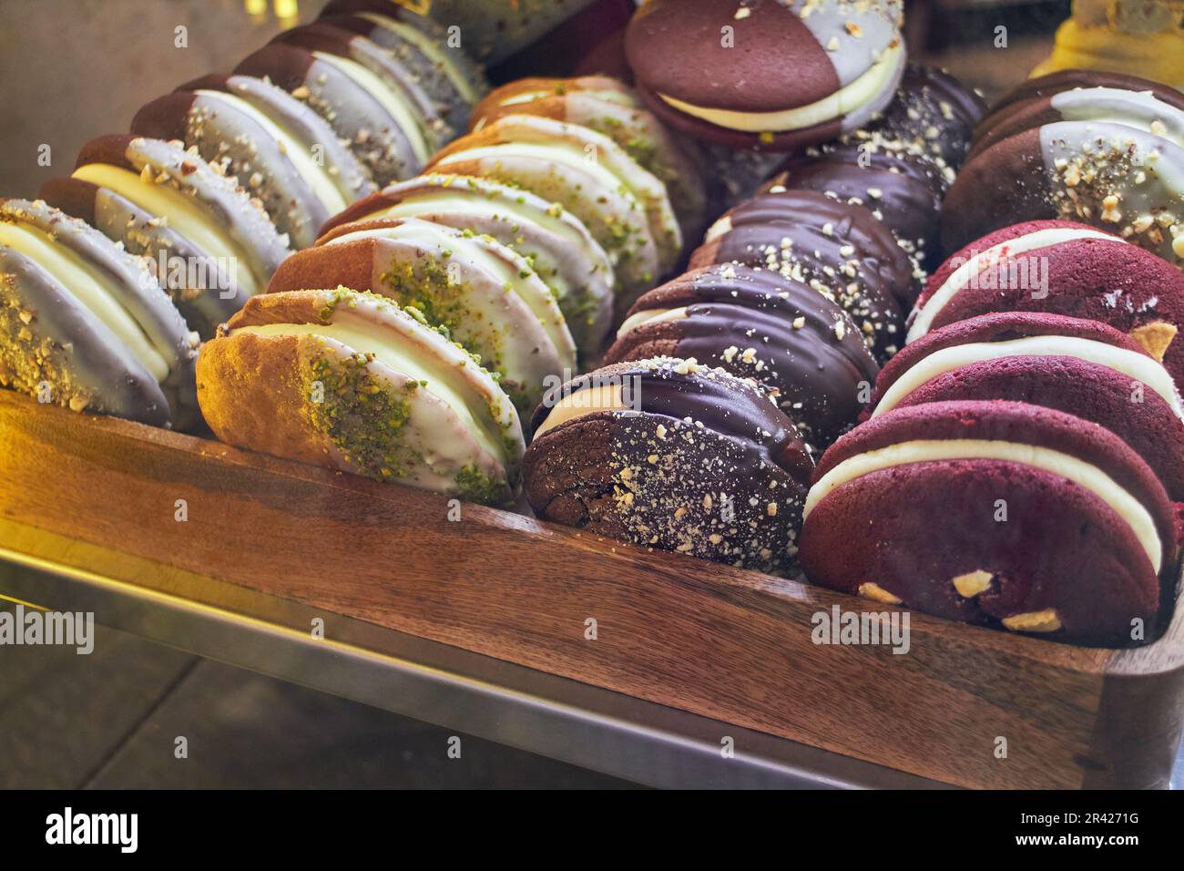 Giant cookies with various flavors and decorations for sale in the market. Fashion sweetness. Stock Photo