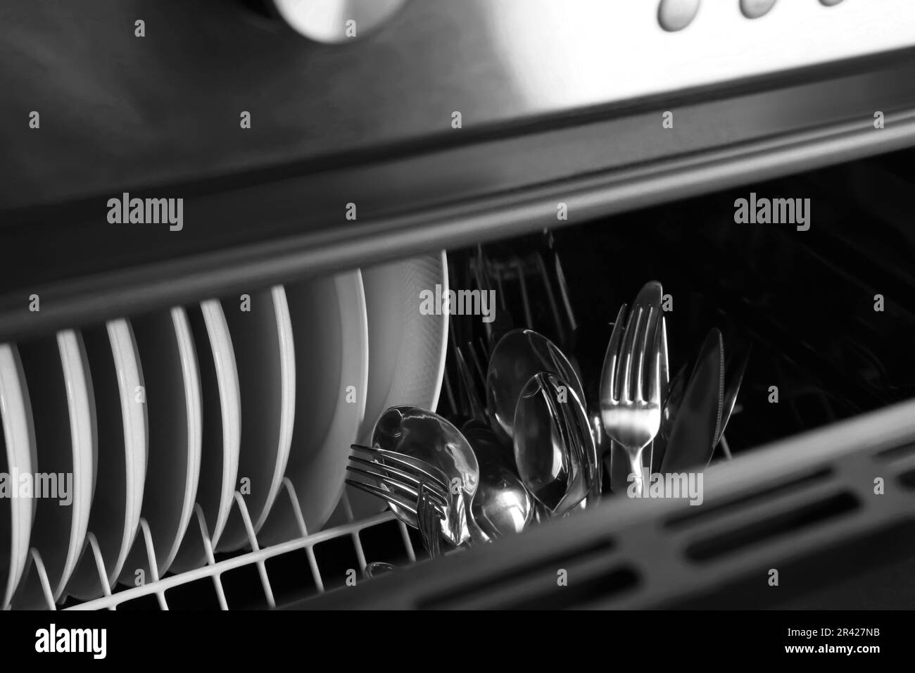 Clean plates and cutlery in dishwasher, closeup Stock Photo Alamy