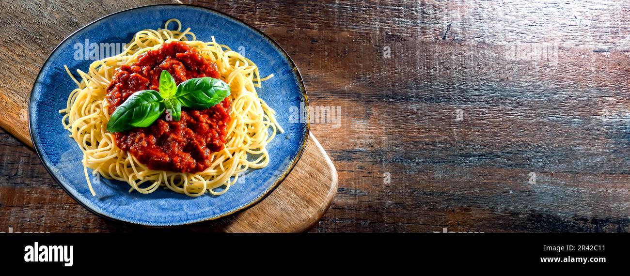 Composition with a plate of spaghetti bolognese. Stock Photo