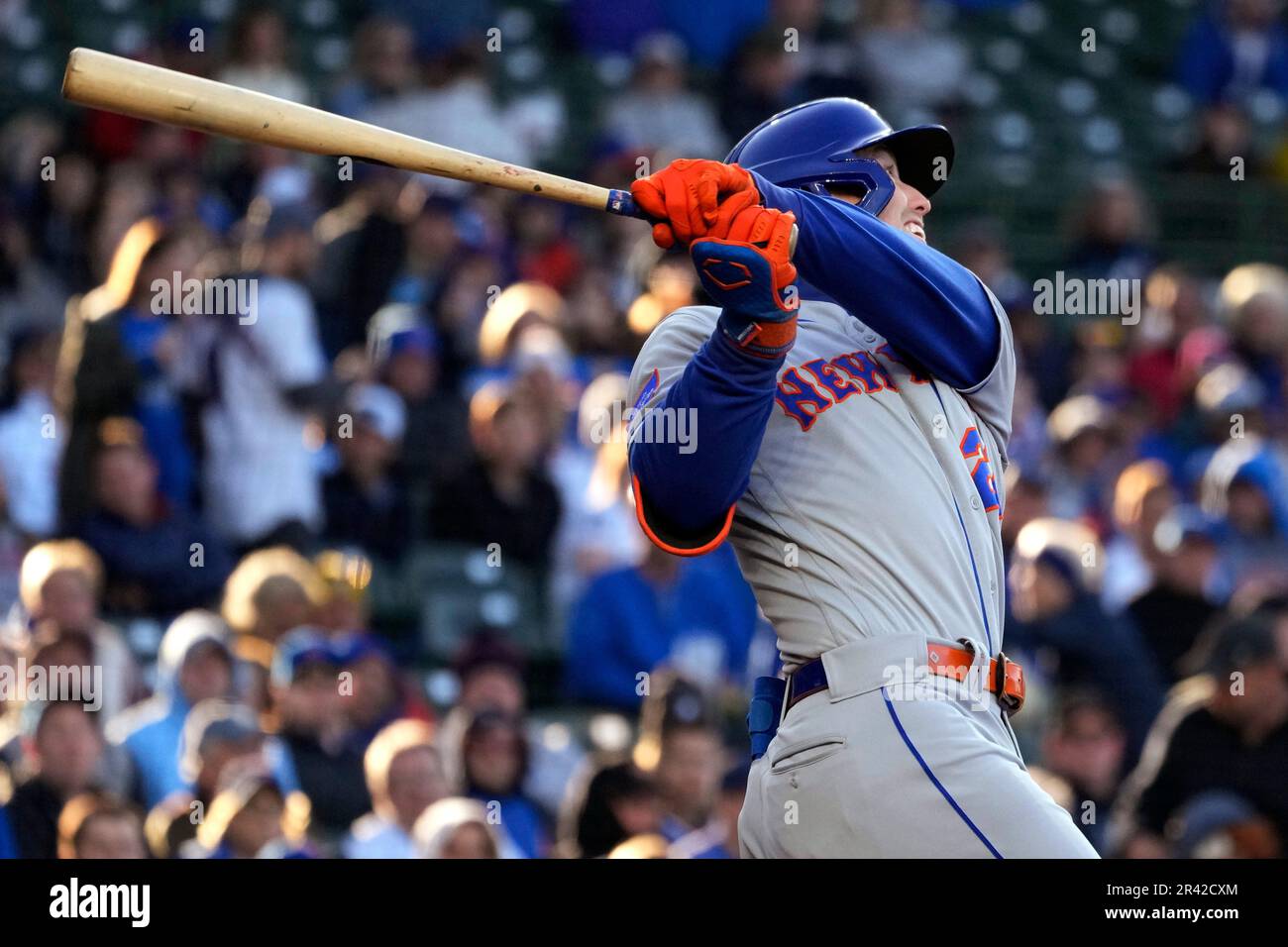 New York Mets' Brett Baty watches his sacrifice fly during the first