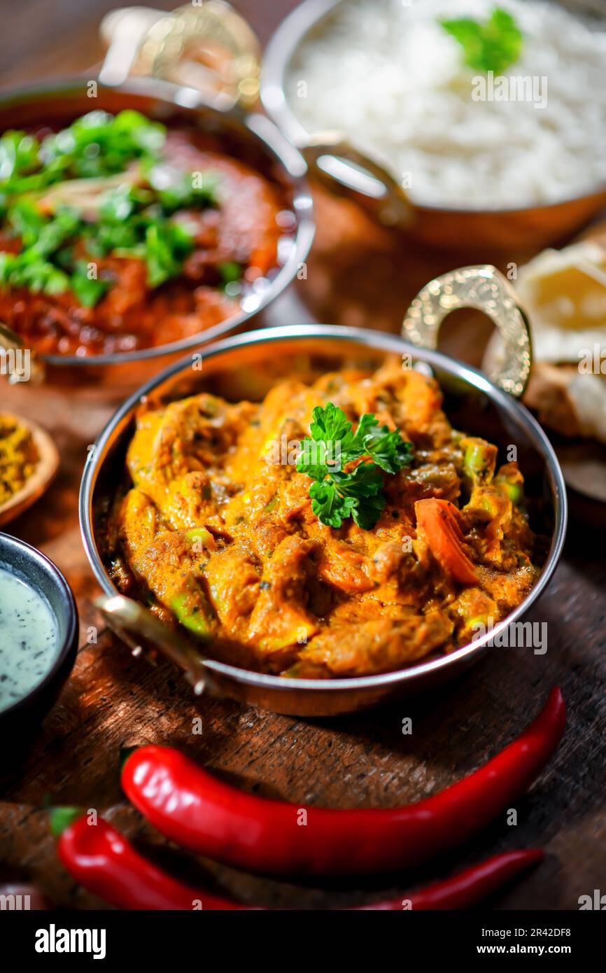 Hot madras paneer and vegetable masala with basmati rice served in