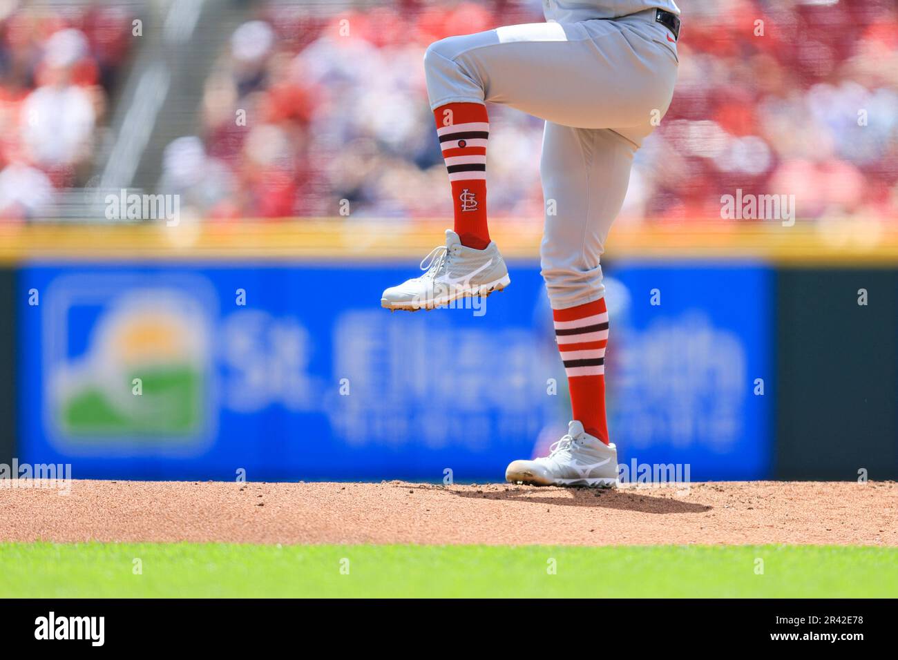 The socks and cleats worn by Cincinnati Reds' Jonathan India are seen as  takes his lead from first base during a baseball game against the St. Louis  Cardinals in Cincinnati, Thursday, May