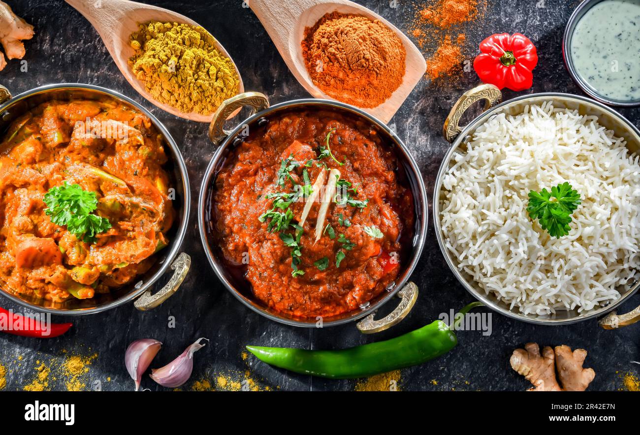 Hot madras paneer and vegetable masala with basmati rice served in