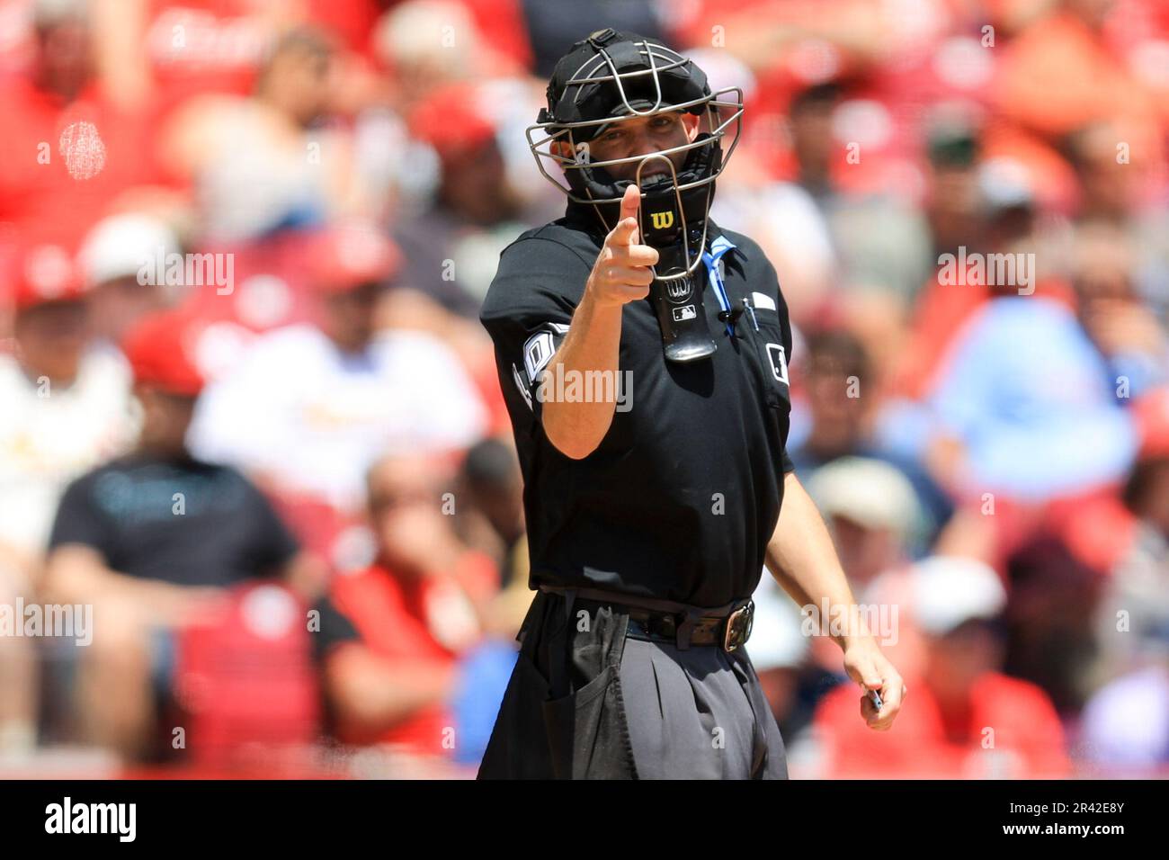 MLB umpire Dan Merzel signals a baseball game between the St. Louis