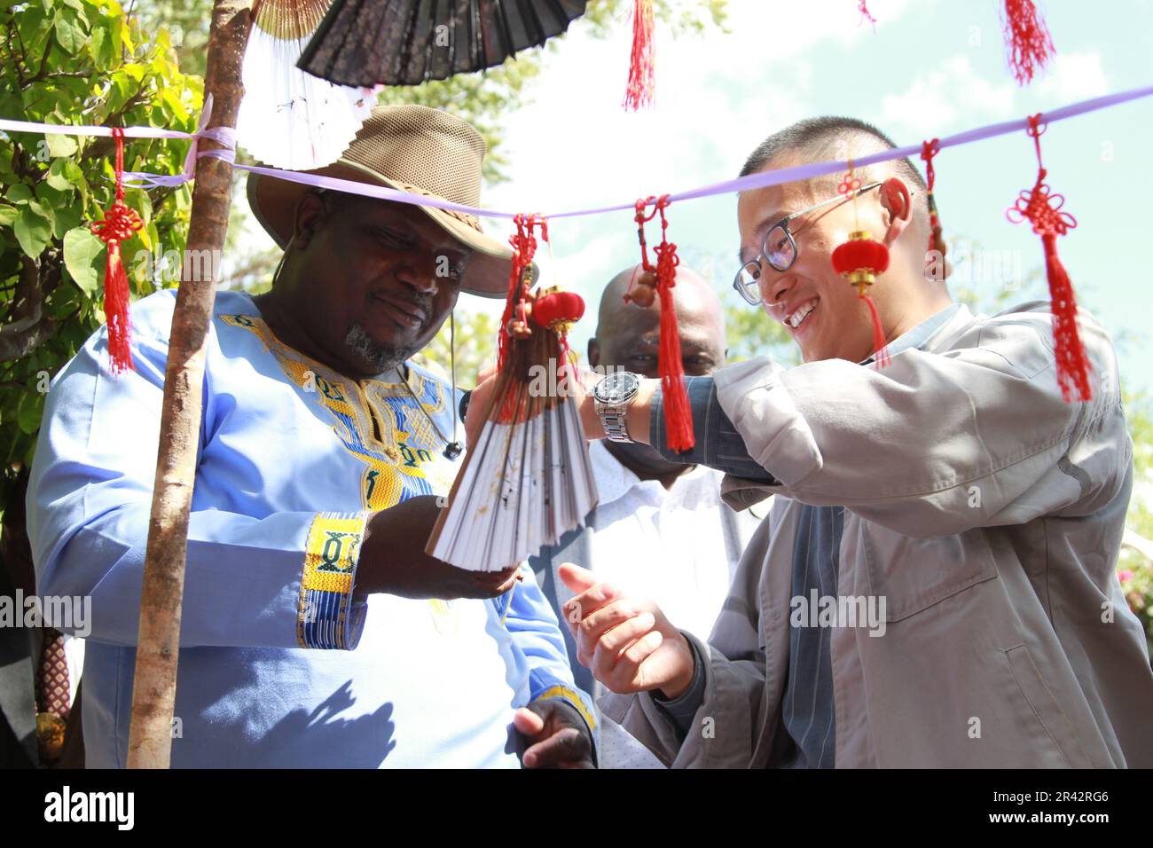 Goromonzi, Zimbabwe. 25th May, 2023. A Chinese man interacts with a