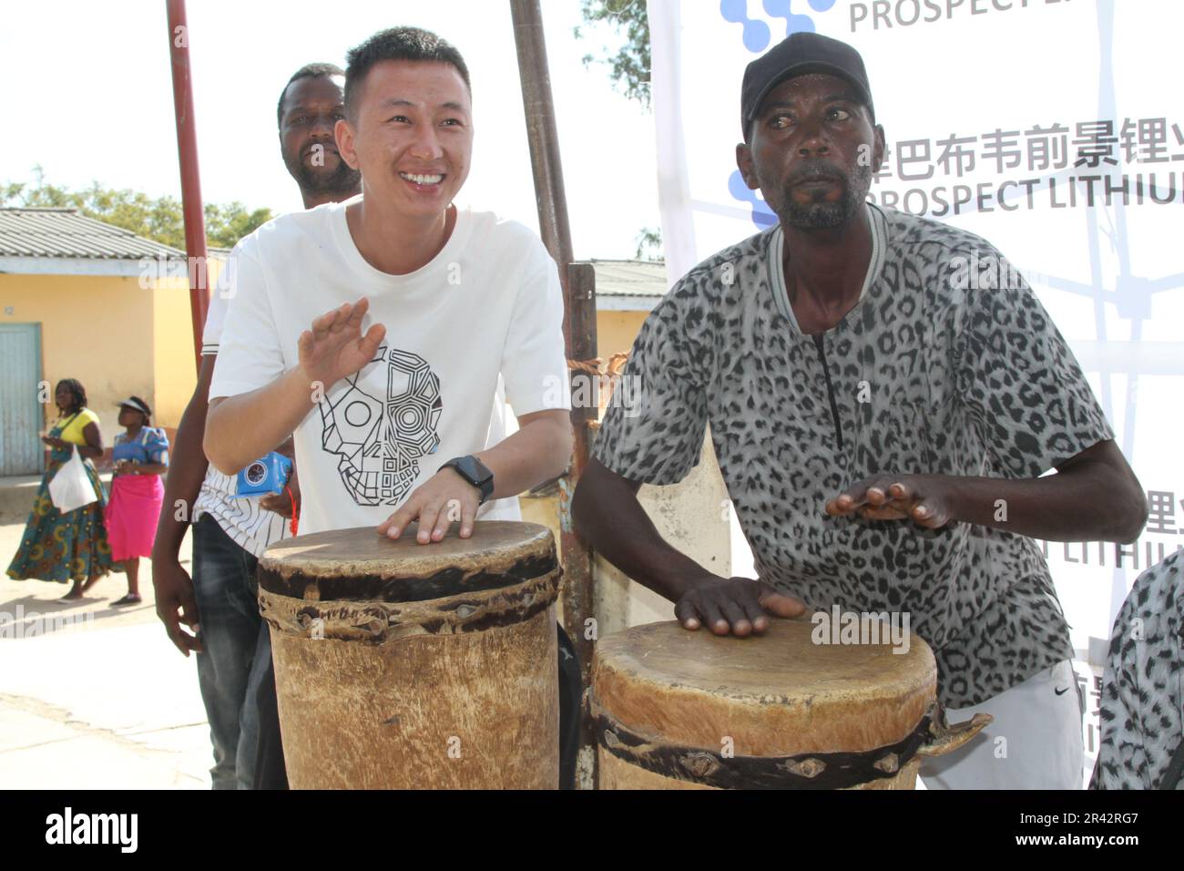 Goromonzi, Zimbabwe. 25th May, 2023. A Chinese man plays African drum