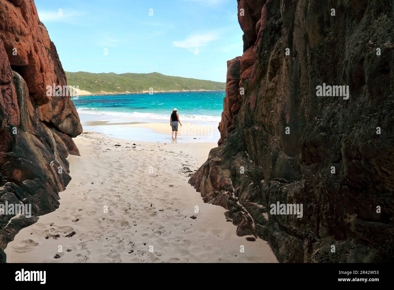 Woman walking on a sandy beach coastline, Cape Hamelin, Southwest Australia Stock Photo