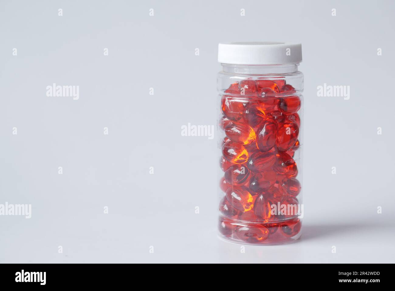 vitamin hair capsule oil in container on white Stock Photo Alamy