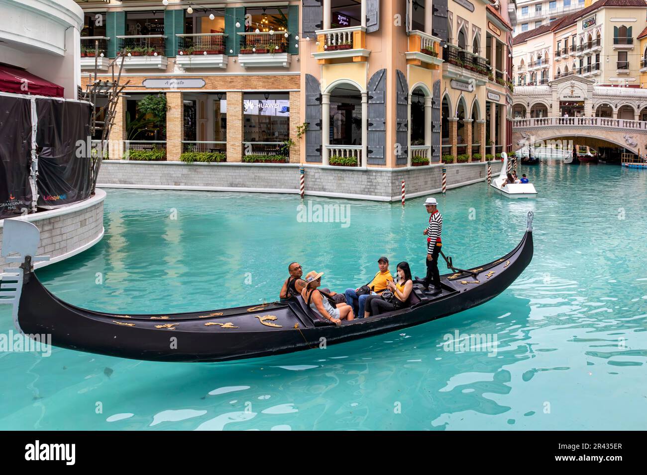 Gondola and gondolier at Venice Grand Canal Mall, Taguig City, Manila, Philippines Stock Photo