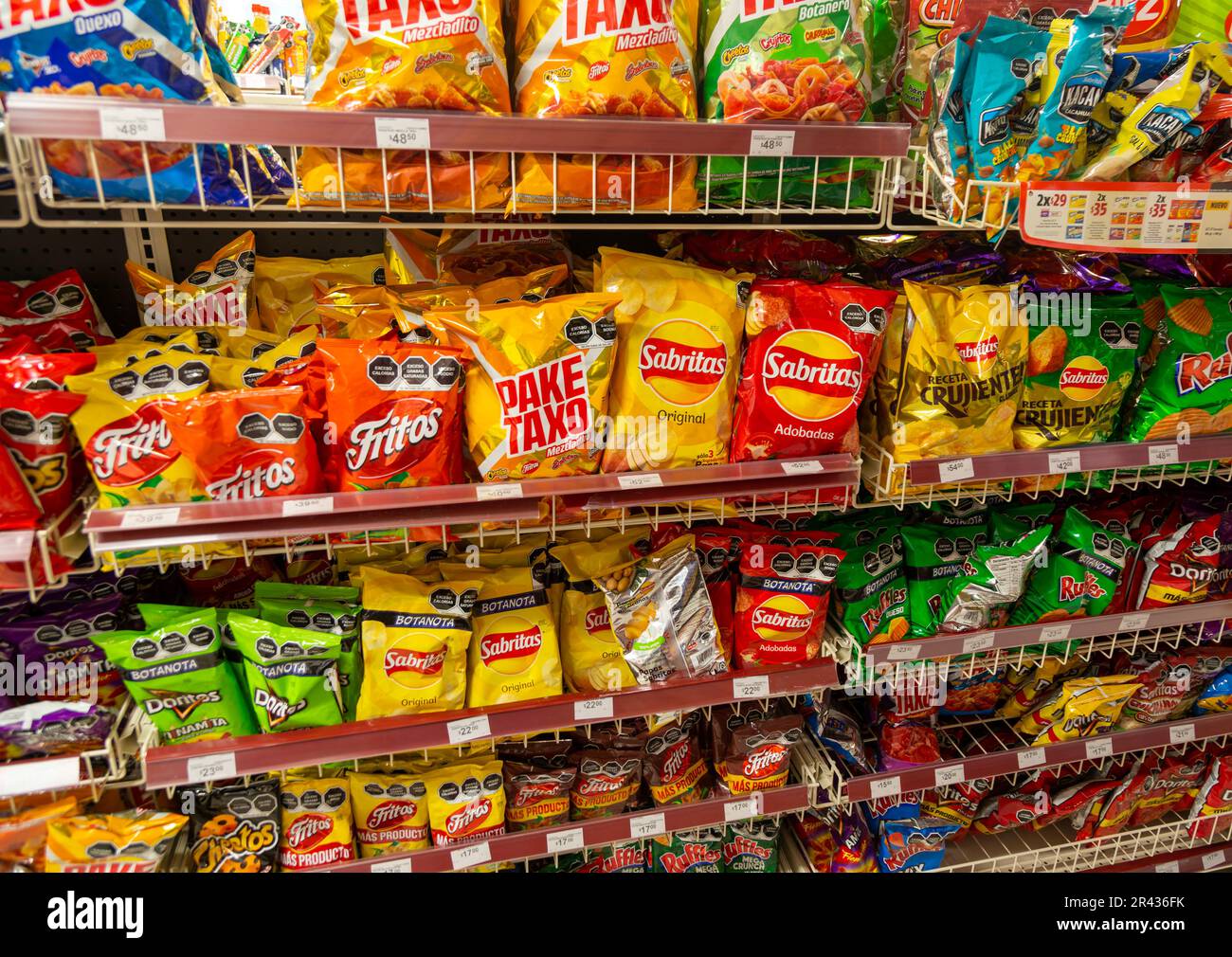 Display rows of packets of crips, bags of chips, potato and corn snacks, Mexico Stock Photo Alamy